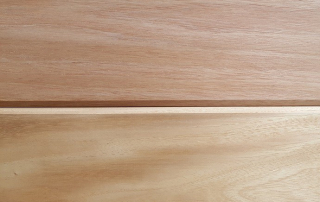 Close-up of V-Joint Fijian Mahogany siding, showcasing its beveled edge design for a classic, elegant look in exterior and interior wood applications.