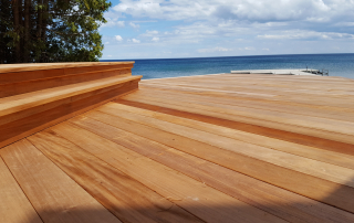 Stunning waterfront deck made from genuine Fijian Mahogany, highlighting its rich grain, durability, and weather resistance. A top choice for sustainable, long-lasting hardwood decking in Ontario, Canada.