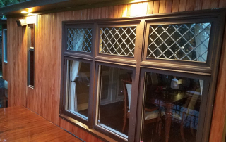 Beautiful home exterior featuring Fijian Mahogany wood siding, showcasing its rich color, weather resistance, and natural durability. A sustainable and stylish choice for long-lasting, low-maintenance home siding in Ontario, Canada.