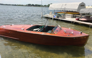 Beautiful handcrafted mahogany boat with a glossy finish, showcasing the durability, water resistance, and elegance of genuine mahogany wood for boat construction. A premium choice for classic and luxury wooden boats in Ontario, Canada.