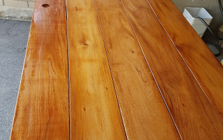 Handmade mahogany wood table with a smooth, glossy finish, showcasing the rich grain and durability of premium hardwood. A perfect woodworking project for DIY enthusiasts and furniture makers using sustainable mahogany in Ontario, Canada.