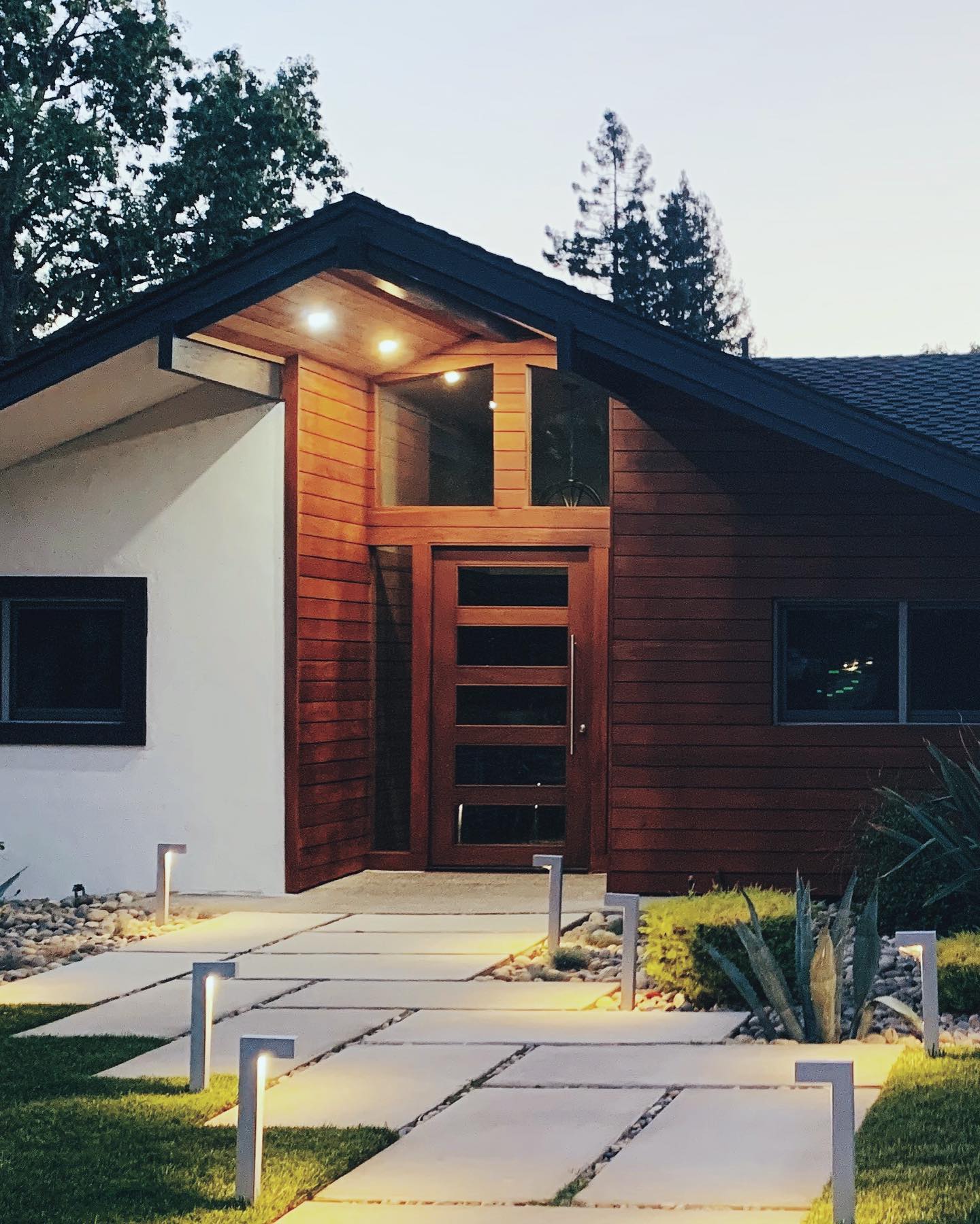 Modern Home with Mahogany Wood Siding Contemporary house featuring premium Mahogany wood siding, creating a warm and elegant exterior. This durable and sustainable hardwood siding enhances curb appeal and provides long-lasting protection, perfect for modern home designs in Ontario, Canada.