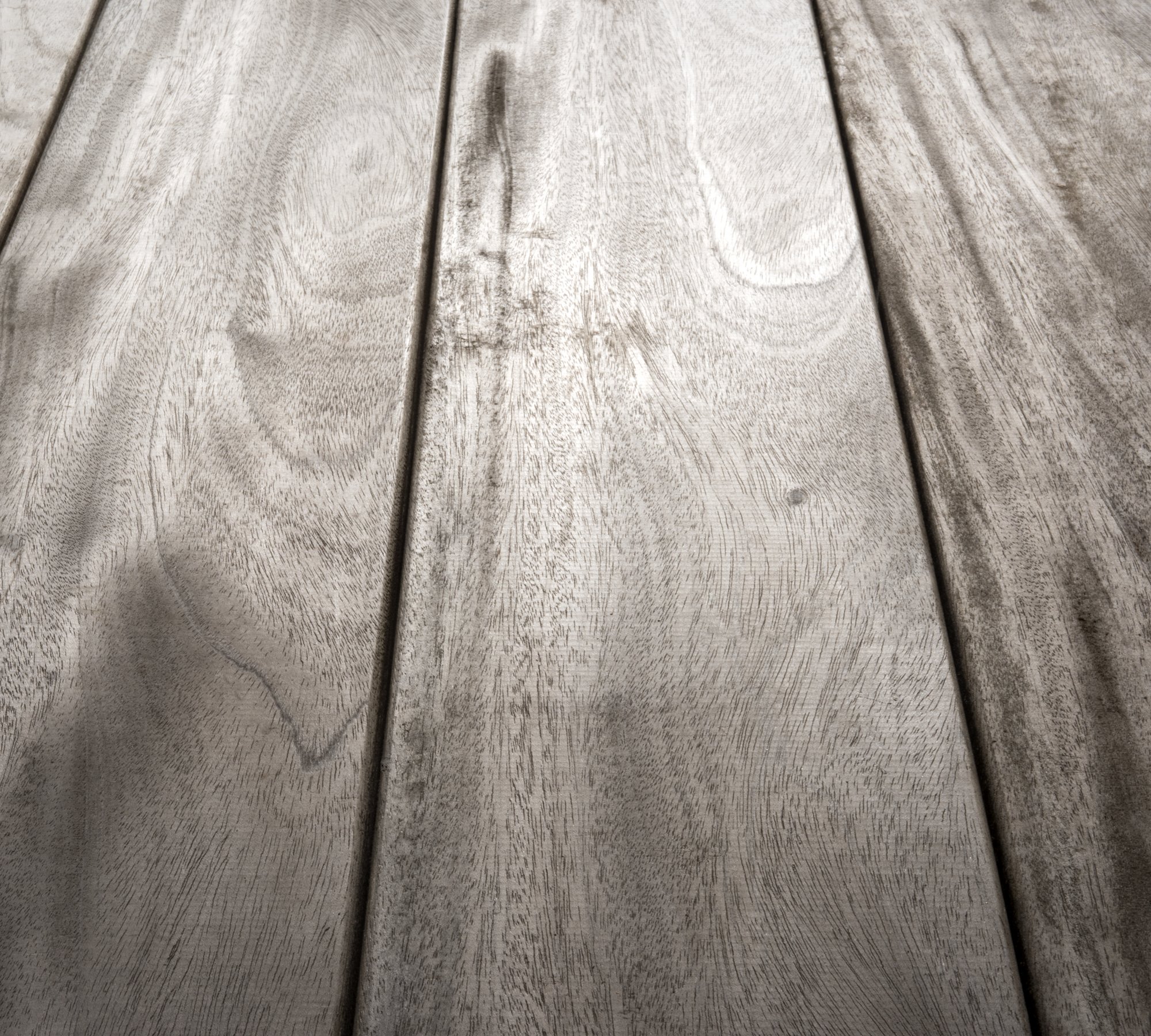 Close-up of Genuine Fijian Mahogany decking, showcasing its natural grain, smooth finish, and durability for outdoor use.